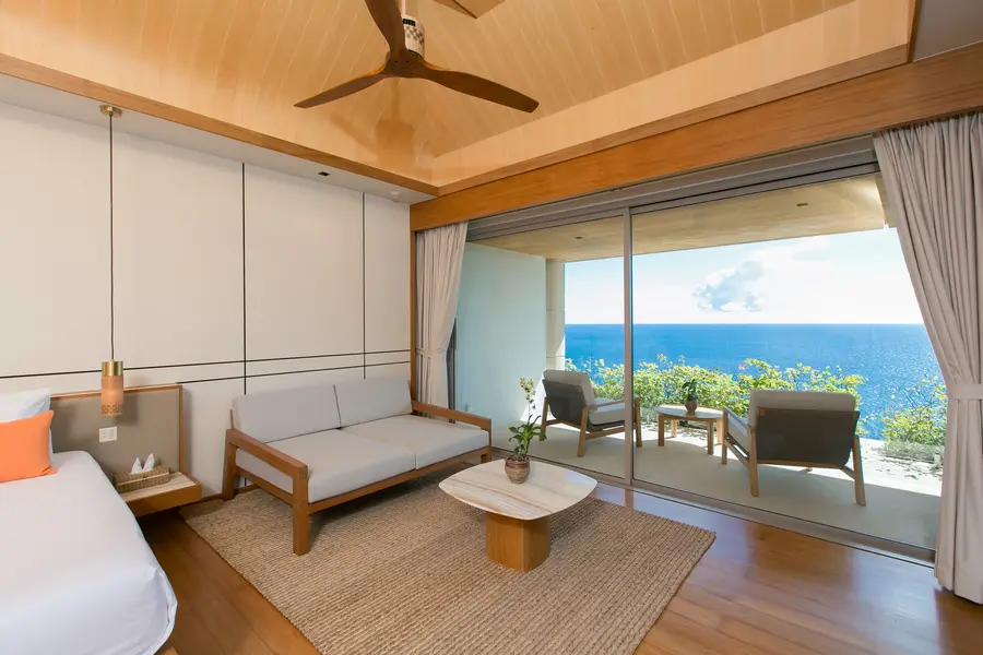 Bedroom 1 sitting area and balcony facing the sea