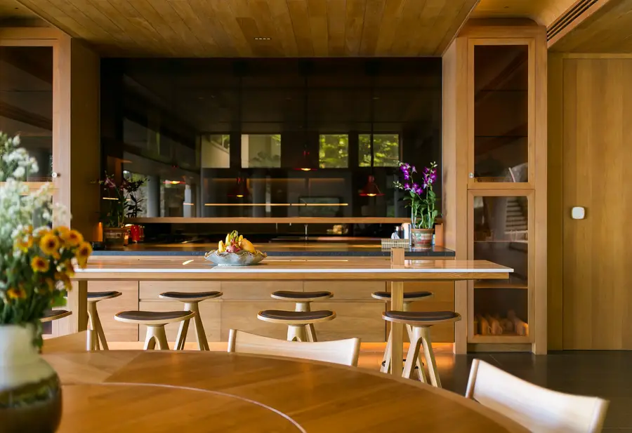 Breakfast bar with stools beside the dining room