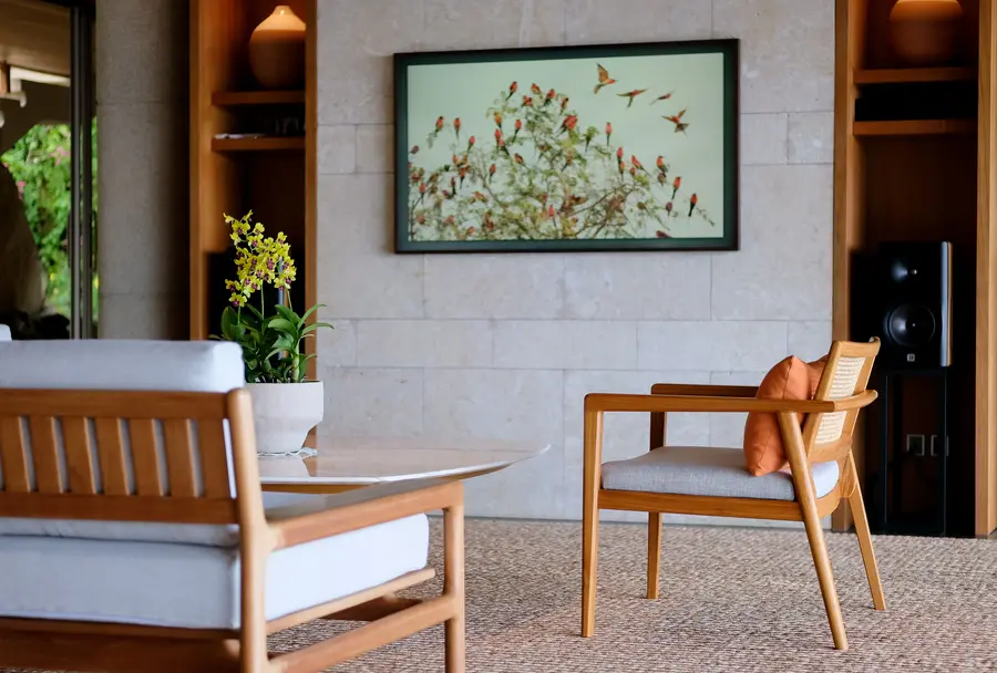 Living room seating beneath the artwork