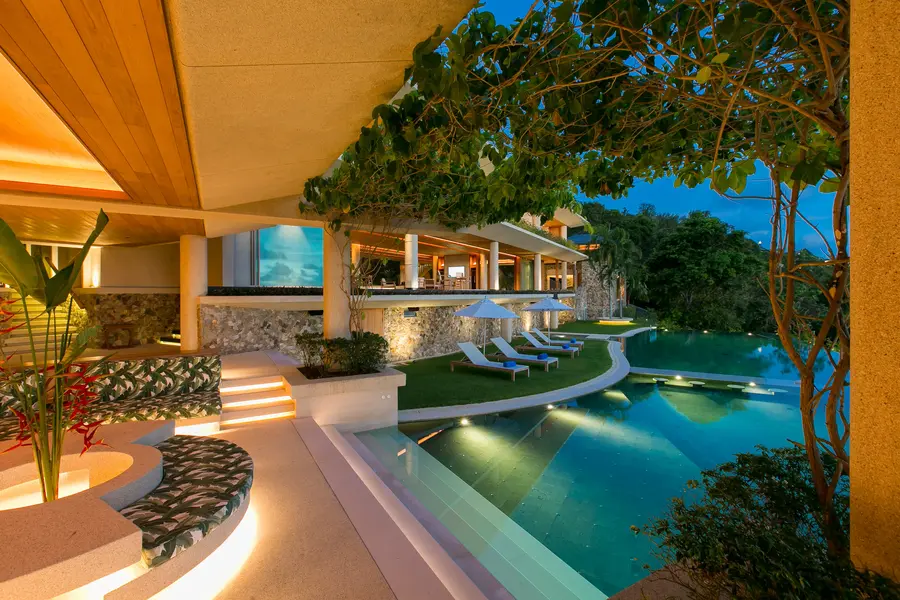 Pool and terraces lit in the evening